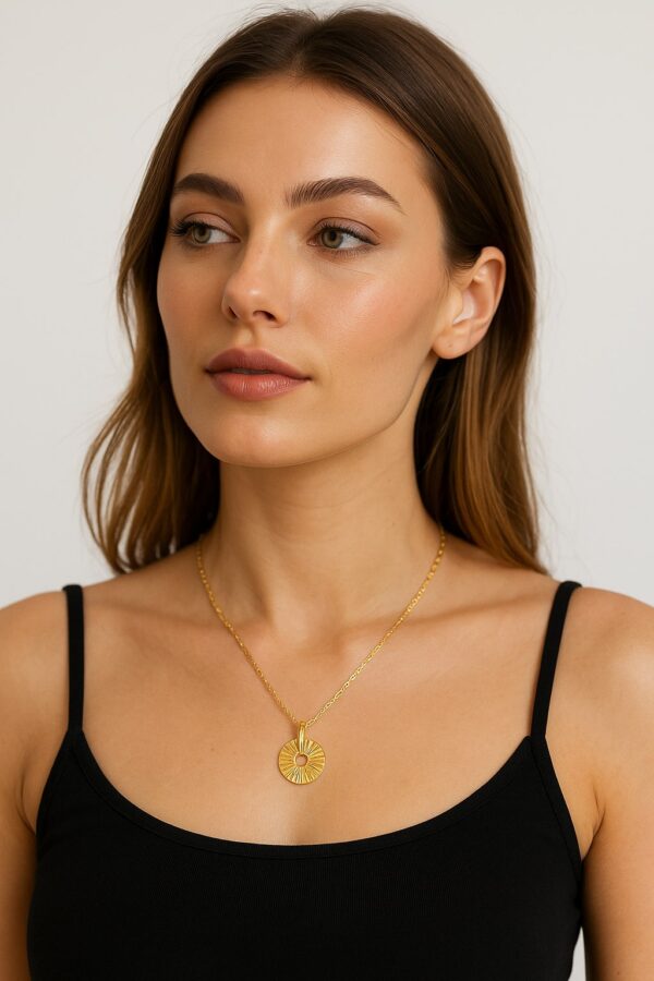 Woman wearing an 18K gold filled fortune necklace with a round charm pendant symbolizing luck, protection, and fortune — a minimalist amulet designed for positive energy and timeless elegance.