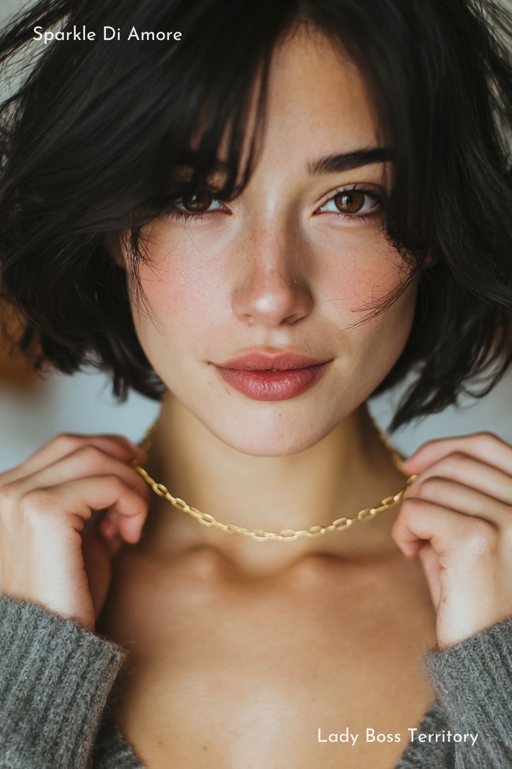 Model wearing a gold paperclip chain necklace with oval links and minimalist design.