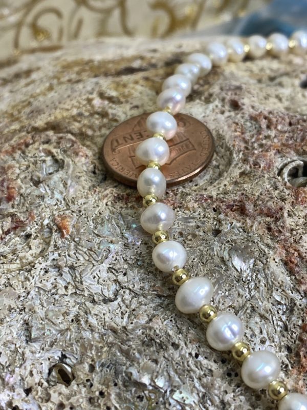 Close-up of Butterfly Bliss Freshwater Pearl Necklace with freshwater pearls