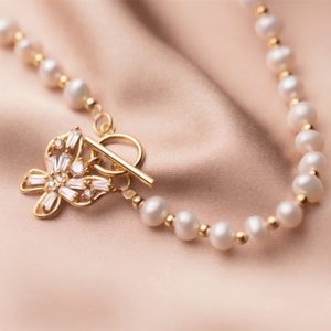 Close-up of Butterfly Bliss Freshwater Pearl Necklace chain with 14k gold over sterling silver beads" 