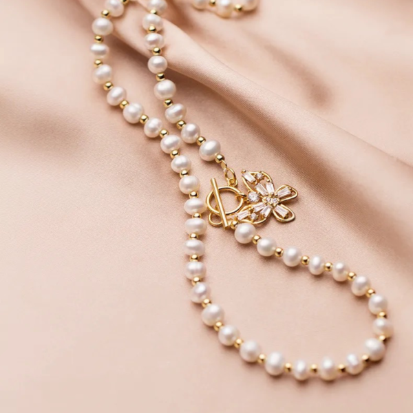 Close-up of Butterfly Bliss Freshwater Pearl Necklace chain with 14k gold over sterling silver beads