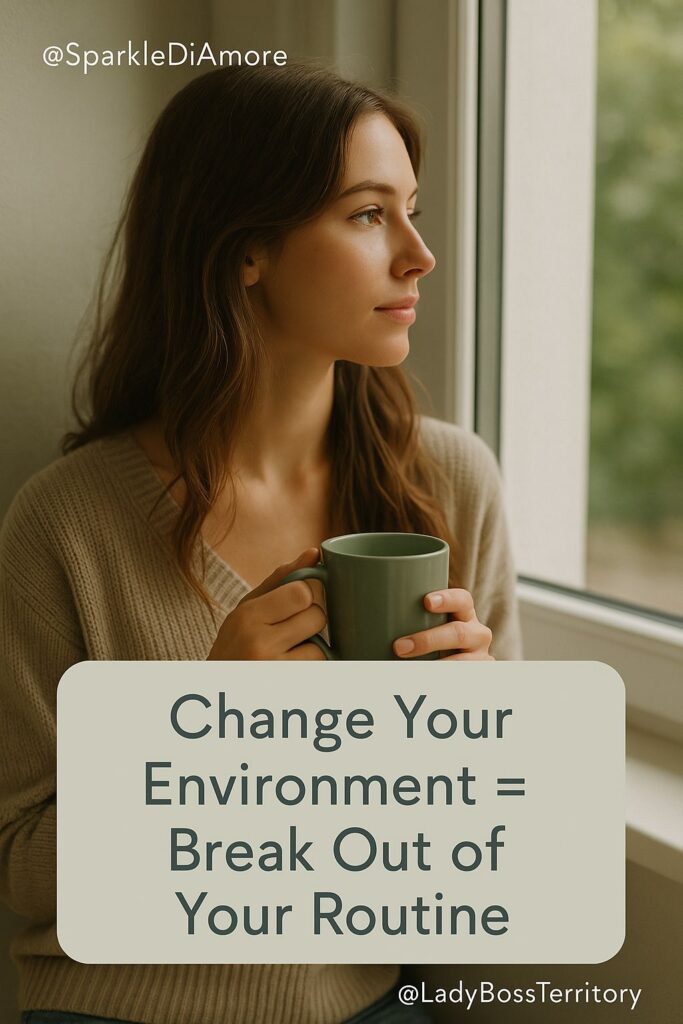 Calm woman holding a mug and looking out the window, symbolizing how changing your environment helps break routines and spark creativity for female entrepreneurs.