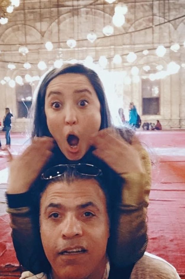 A couple sharing a funny and surprised moment inside the Mohammed Ali Mosque in Cairo, Egypt, capturing a playful side of their visit.