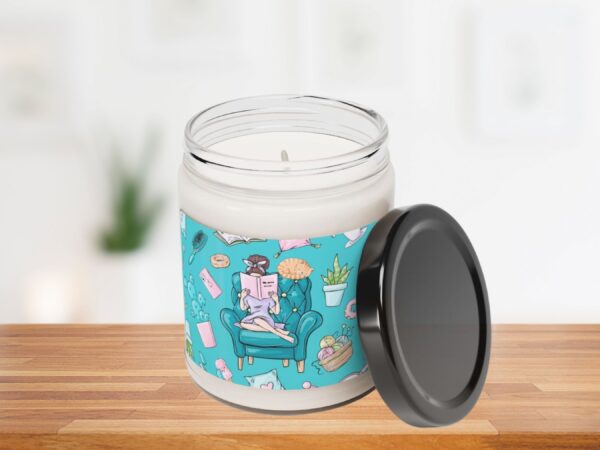 Exquisite scented candle in glass jar with a boss lady reading on a couch