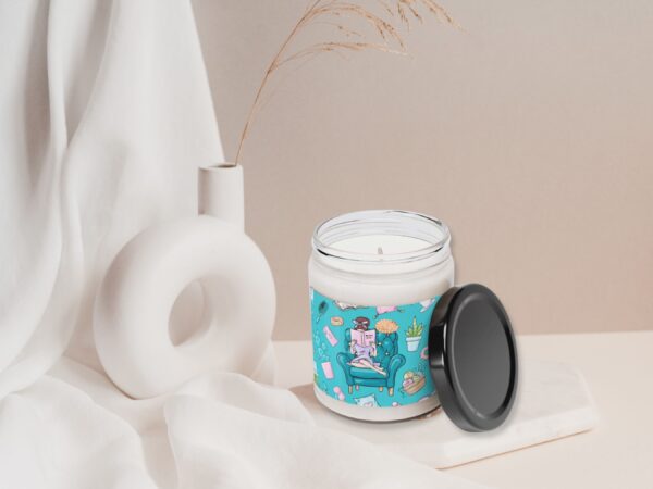 Close-up of scented candle with botanical decorations
