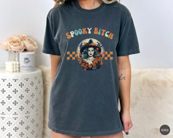 Confident boss lady in Comfort Colors® Spooky Bitch Halloween Tee.