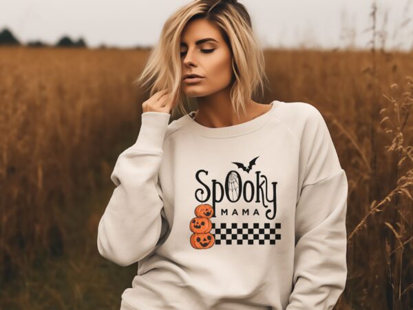 A Sandstone "Spooky Mama" Sweatshirt featuring a pumpkin design, perfect for serene style seekers.