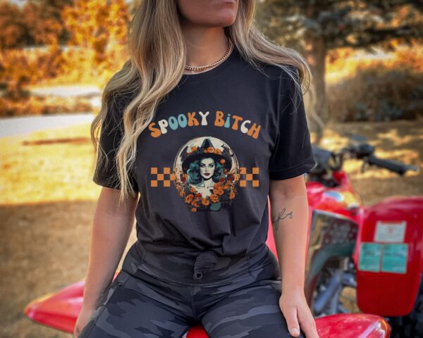 Model showcasing Comfort Colors® Spooky Bitch Halloween Tee in black.