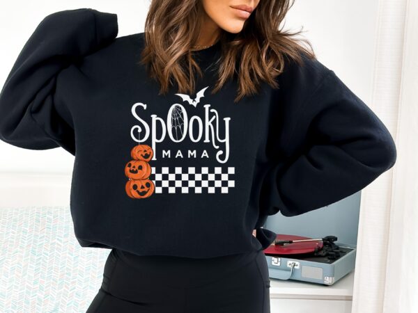 A black "Spooky Mama" Sweatshirt with a pumpkin design, perfect for embracing the night.