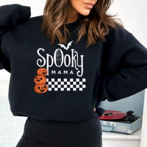 A black "Spooky Mama" Sweatshirt with a pumpkin design, perfect for embracing the night.