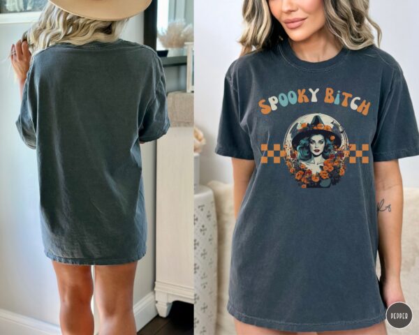 Model wearing Comfort Colors® Spooky Bitch Halloween Tee in pepper gray.