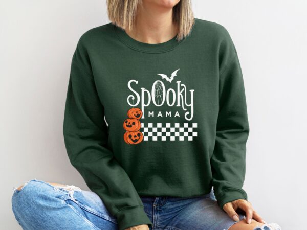 A Forest Green "Spooky Mama" Sweatshirt adorned with a pumpkin design, perfect for nature enthusiasts.