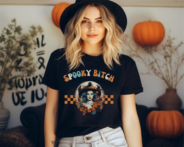 Independent woman wearing Comfort Colors® Spooky Bitch Halloween Tee.
