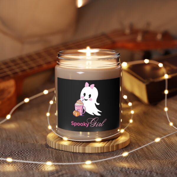 Safety-focused Halloween candle burning with a cute ghost design.