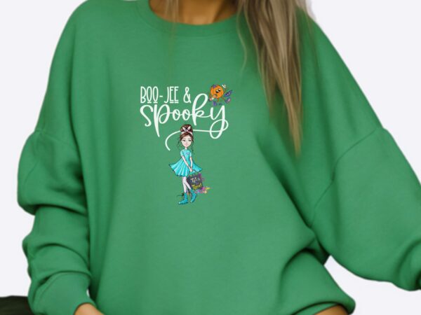 A model wearing our kelly green 'Boojee and Spooky' Halloween sweatshirt with a chic pumpkin and spooky girl design.