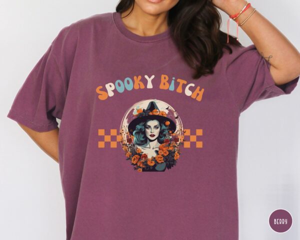 Model wearing Comfort Colors® Spooky Bitch Halloween Tee in berry red