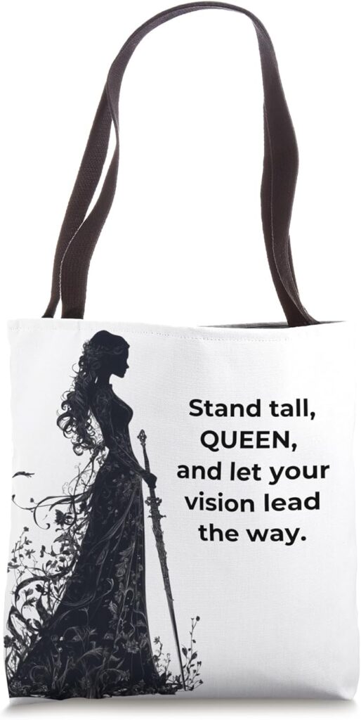 White tote bag featuring a silhouette of a queen warrior with the quote "Stand tall, QUEEN, and let your vision lead the way.