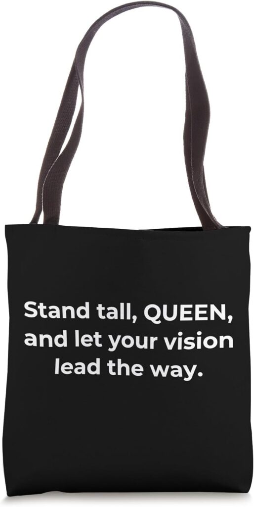 Minimalist black tote bag with the quote "Stand tall, QUEEN, and let your vision lead the way" in bold white text.