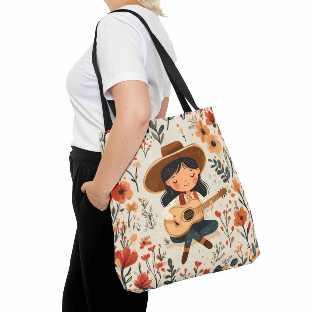 Stylish woman carrying a Western girl floral tote bag, featuring a design of a girl with a guitar surrounded by flowers.