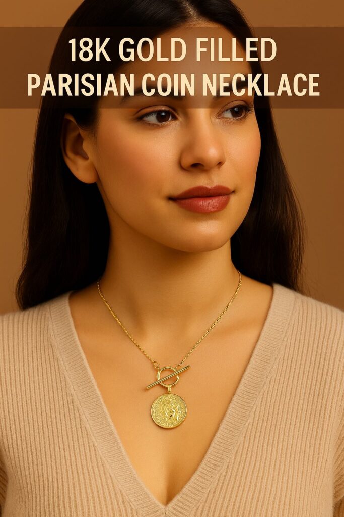 Woman wearing 18K gold filled Parisian coin necklace, styled with a neutral beige sweater for effortless minimalist chic. Elegant gold jewelry trend for 2025.