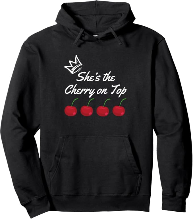 Stylish black pullover hoodie with cherry design and 'She’s the Cherry on Top' text—trendy fashion statement piece.