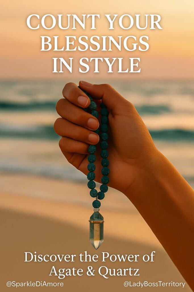 Hand holding an agate and quartz gemstone mala necklace at the beach during a serene sunset.