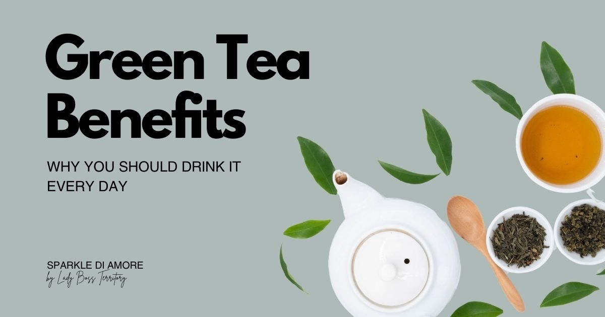 Flat lay of green tea cup, teapot, loose tea leaves, wooden spoon, and fresh green tea leaves on a pastel background.