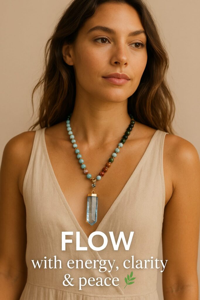 Model wearing a handmade stone beaded gemstone necklace with a titanium quartz pendant in soft aqua and earthy tones, styled in a natural boho chic look.