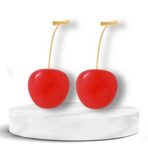 Trendy cherry drop earrings with gold stems on white background